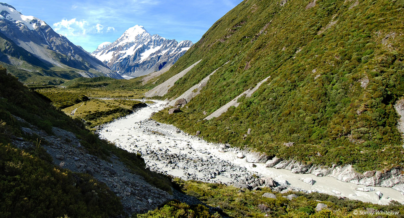 Facing North East: water from the Hooker Glacier feeds into the Tasman River from the western side of Aoraki Mt Cook (centre background)
