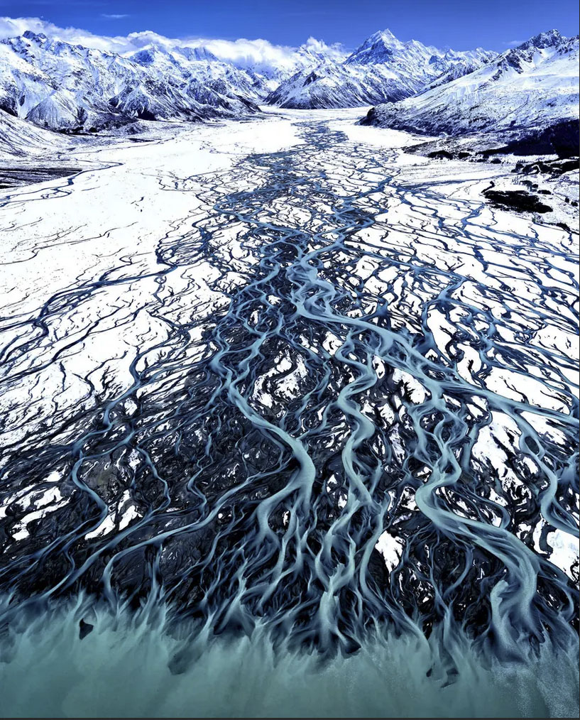 'Glacial Blue' by Stuart Chape: "Aerial view from a helicopter of the glacial blue waters of the Tasman River flowing into Lake Pukaki from the high mountains of Aoraki-Mount Cook National Park, New Zealand.”